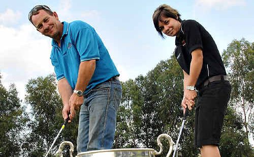 Gunabul club captain Brad Richards and competition organiser Kelli Thorne putt for the Gunabul Cup. Gunabul club captain Brad Richards and competition organiser Kelli Thorne putt for the Gunabul Cup.